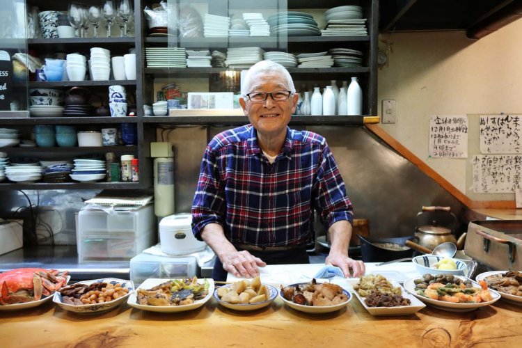 店主の中川尚さん。この笑顔に惹かれて足を運ぶ常連も多い。