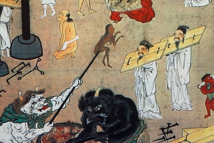 三つ目の鬼が茹で上げた亡者を高く掲げる。