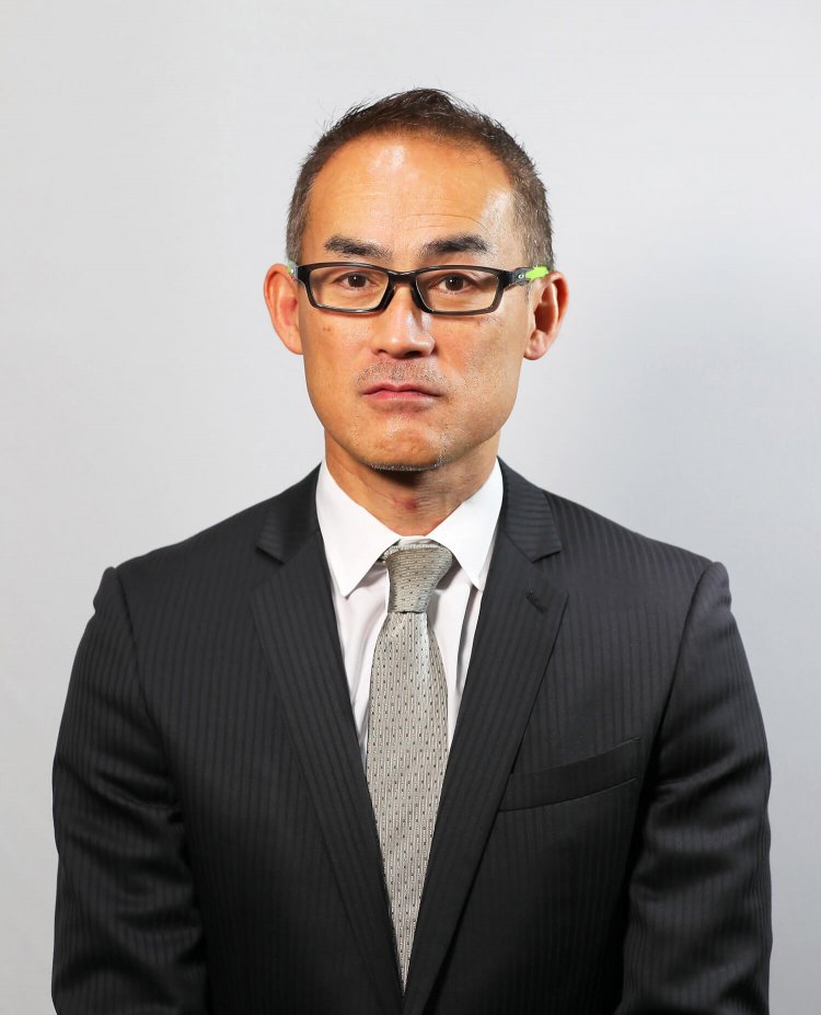 日本陸上連盟経営企画部長の石井朗生さん。学生時代は十種競技選手だった。「陸上は人間が持つ根源的な力を競うことが醍醐味です」。