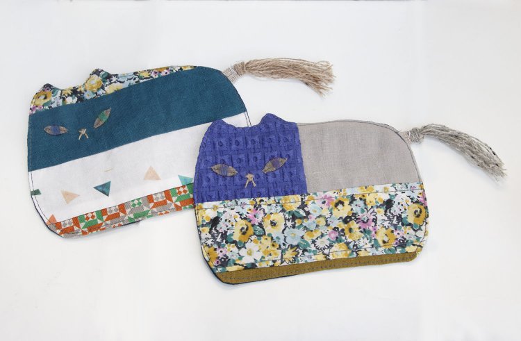 Pienaさんの猫コースター各1000円。九州の布もの作家によるパッチワーク作品。布の組み合わせが絶妙で、小皿も置けるくらいの大きさがいい。