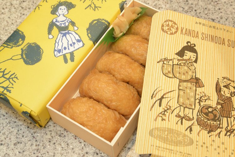 包装紙の絵は鈴木信太郎氏、箱蓋は谷内六郎氏。