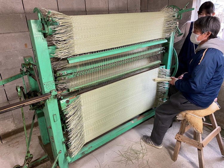 手前が諸冨康弘さん。