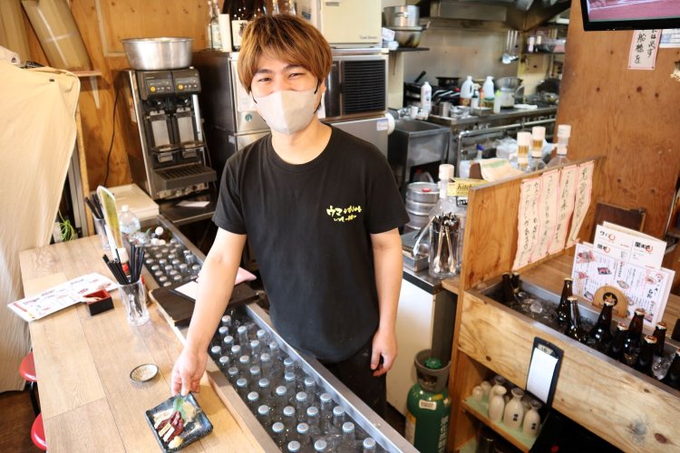 船橋店店長の田中さん。