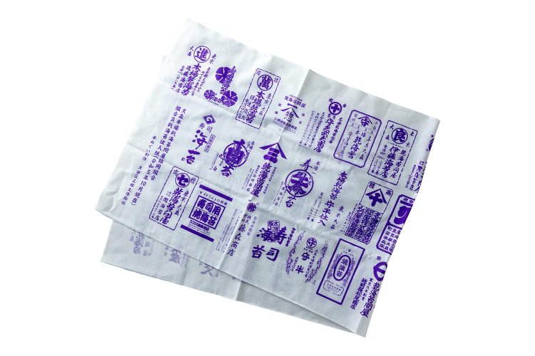 同じく郷土博物館製作の大森本場乾海苔問屋協同組合で用いる商標紙柄の手ぬぐい500円。